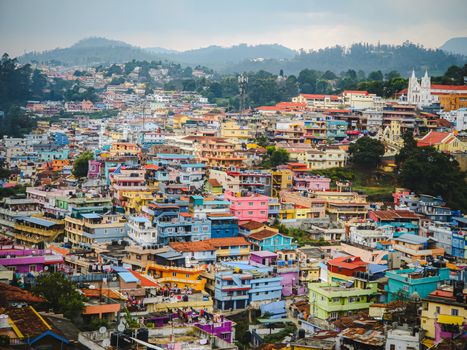 Vibrant aerial view of colorful rooftops in Ooty, India, showcasing urban diversity and vibrant architectural design.