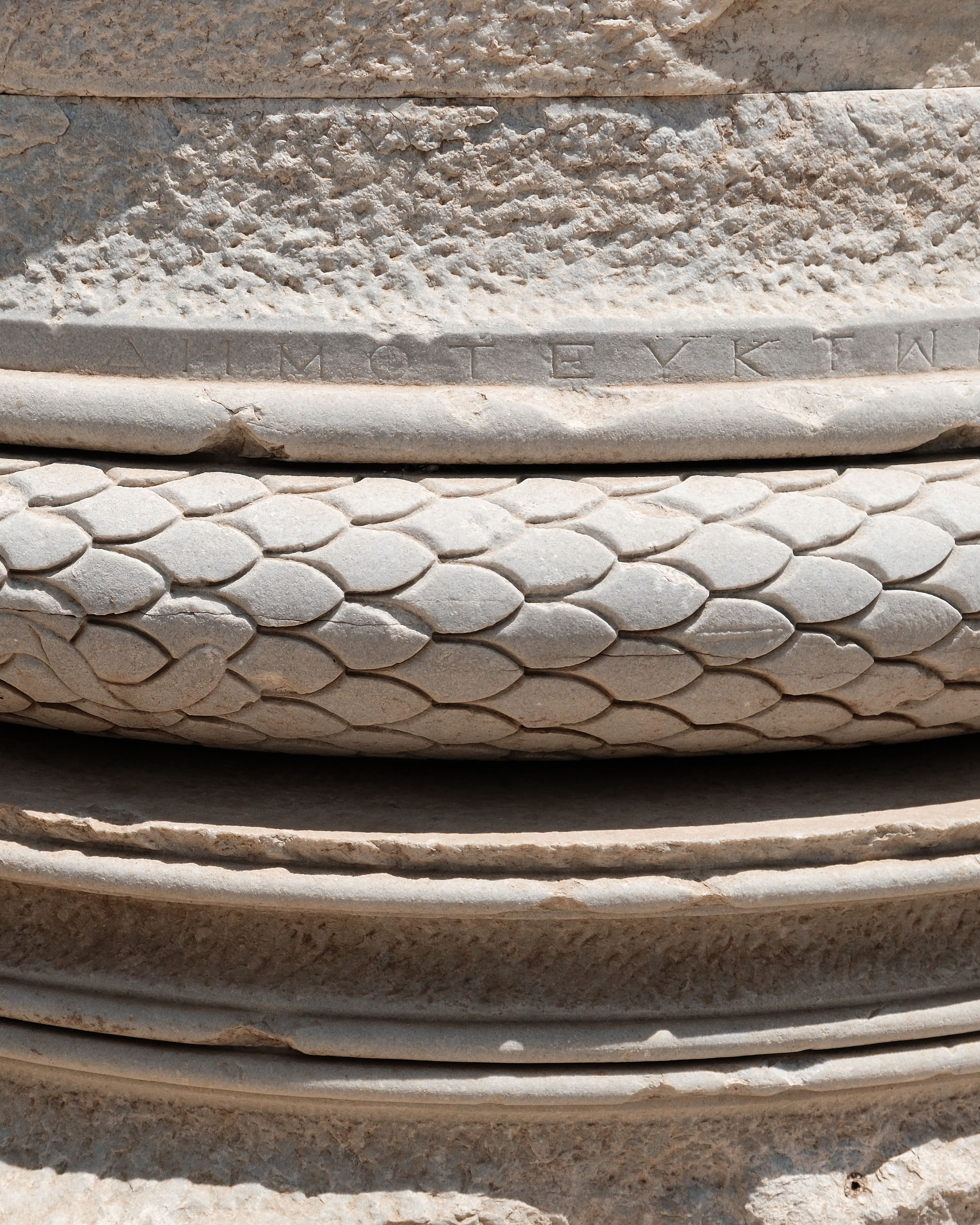 Detailed Stone Carving of Ancient Column Base · Free Stock Photo