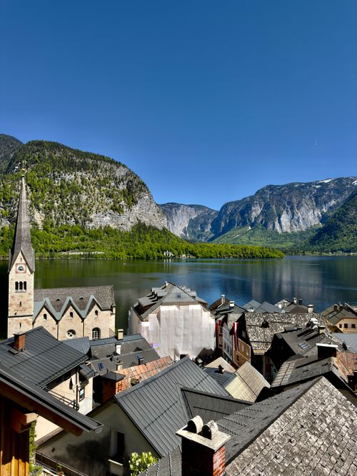 Free Breathtaking view of Hallstatt village and the surrounding Alps on a sunny day. Stock Photo