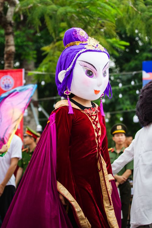 Free Colorful festival parade featuring a vibrant mascot costume in Haiphong, Vietnam. Stock Photo