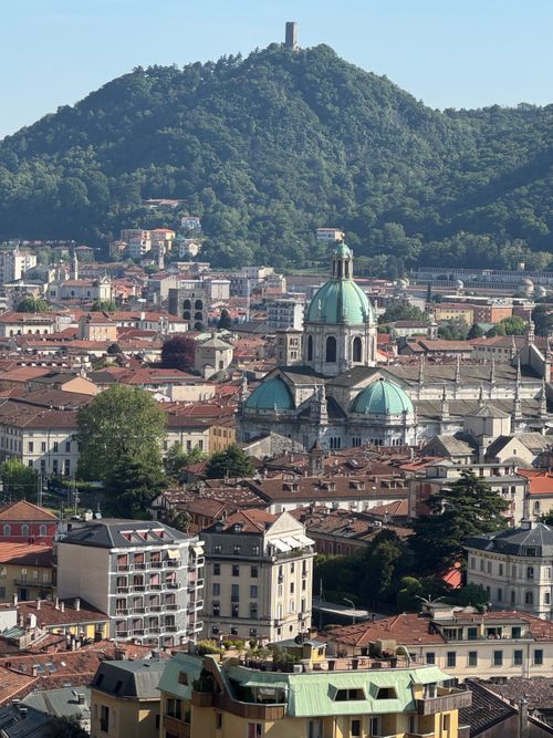 Free Breathtaking aerial view of Como cityscape highlighting the iconic Cathedral and lush mountains. Stock Photo