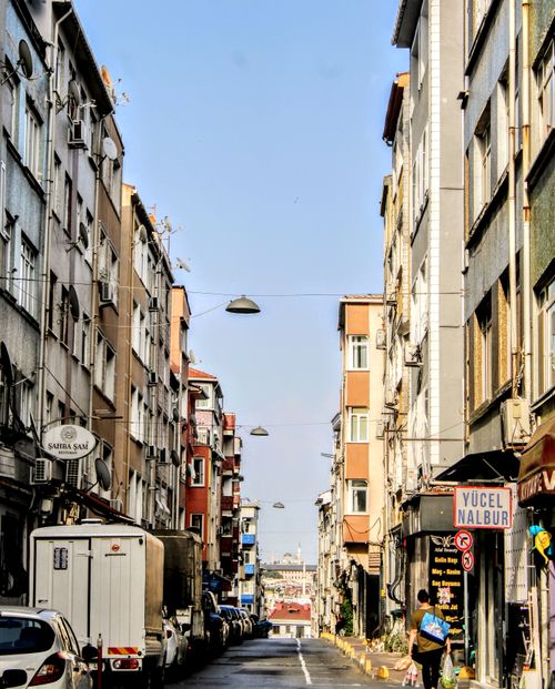 Free Lively urban street view capturing the essence of İstanbul's vibrant district with pedestrians and vehicles. Stock Photo