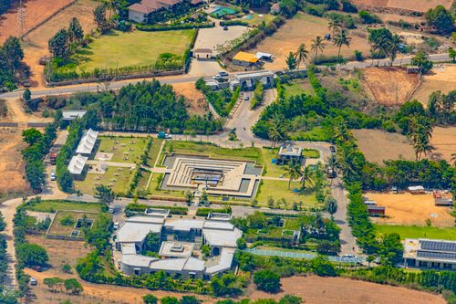 Free A stunning aerial view of landscaped architecture in Nandi Hills, Karnataka, India. Lush greenery surrounds modern structures. Stock Photo