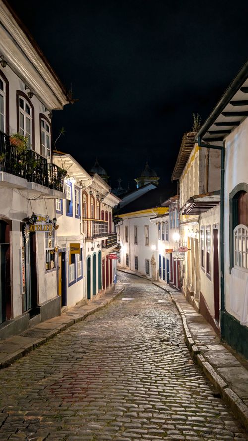 Free Charming night view of Ouro Preto's cobblestone street, showcasing colonial architecture in Brazil. Stock Photo