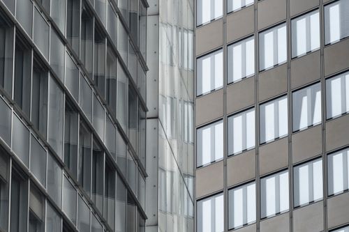 Free Close-up of modern high-rise office buildings with reflective windows in downtown Frankfurt, Germany. Stock Photo