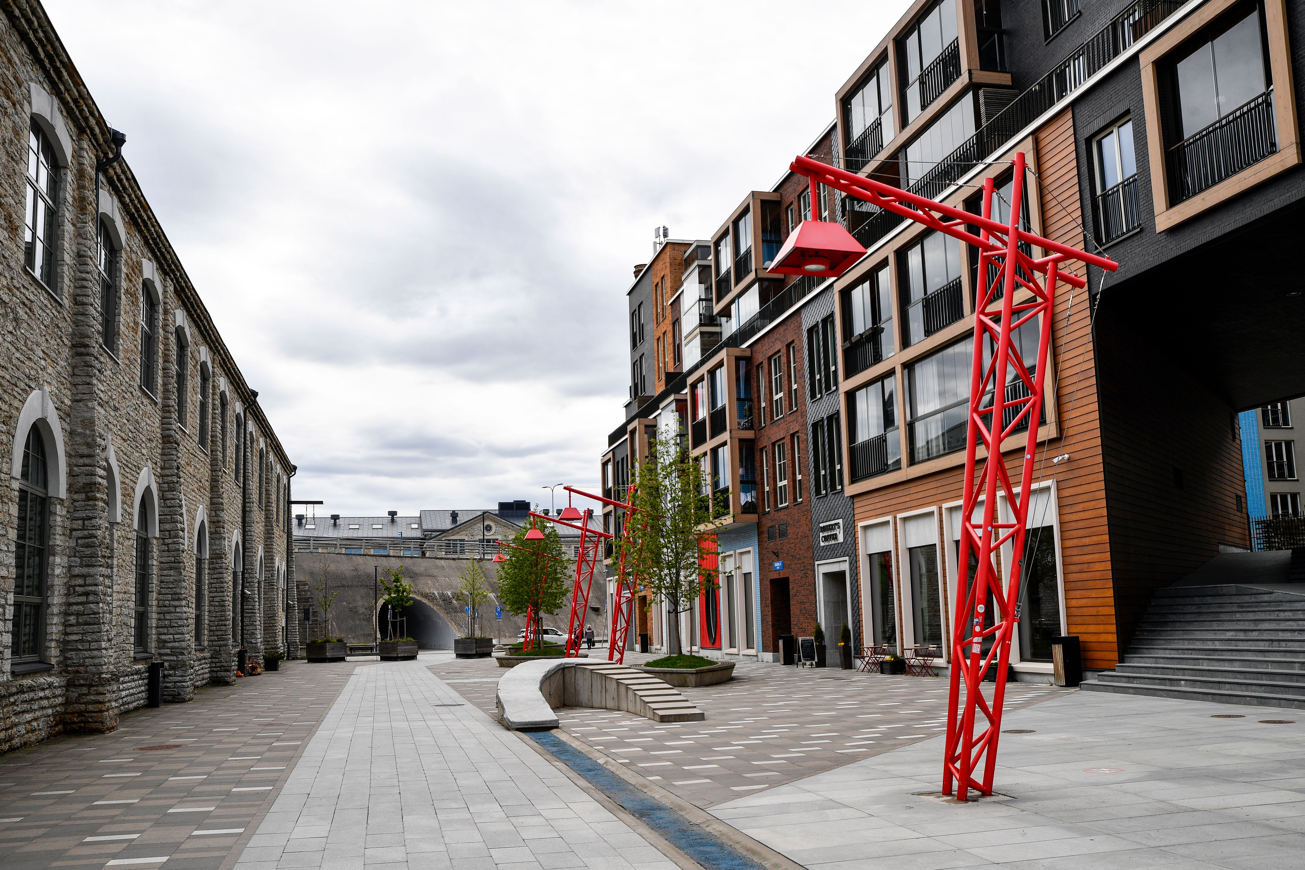 Painted brick warehouses and outdoor tables at Telliskivi Creative City in Tallinn