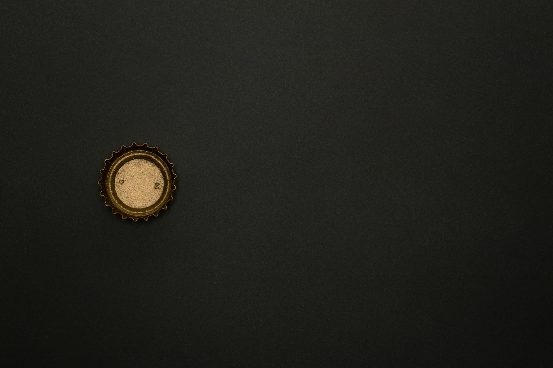 Gold Bottle Top on Black Background