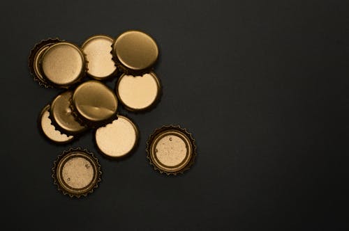Metallic Gold Bottle Caps In Close Up View