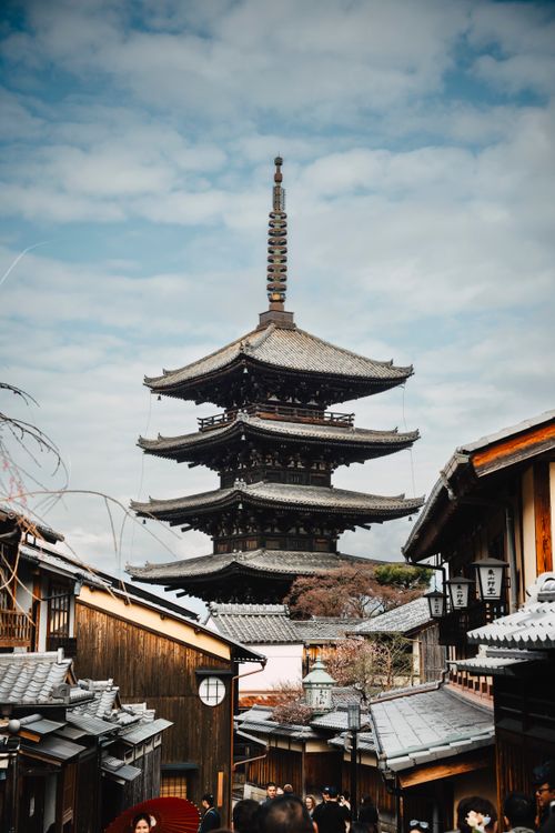 Free Scenic view of a traditional pagoda amidst historic buildings in Kyoto, Japan. Stock Photo