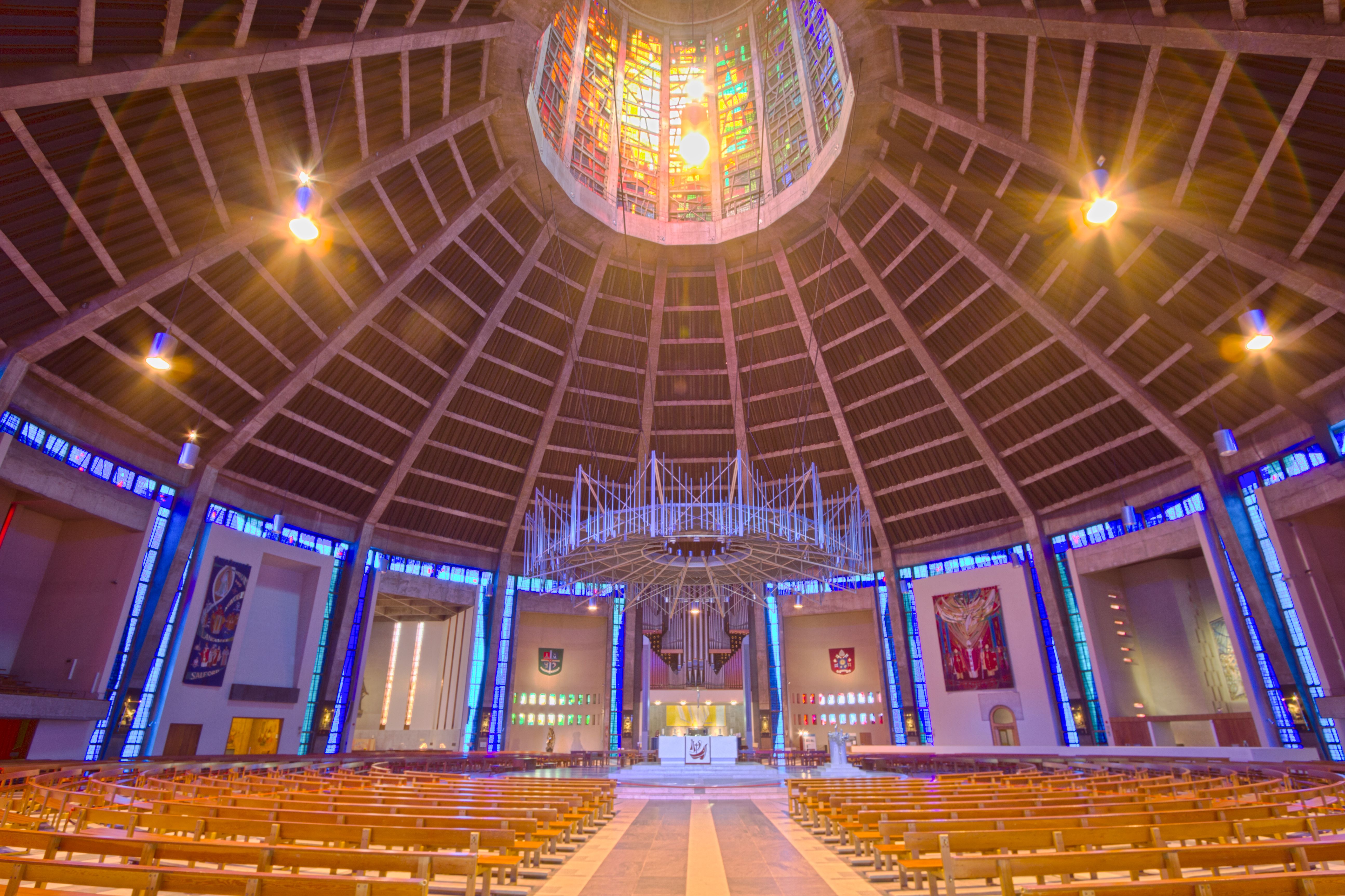 Explore the vibrant interior of Liverpool Metropolitan Cathedral with its stunning stained glass and architectural beauty.
