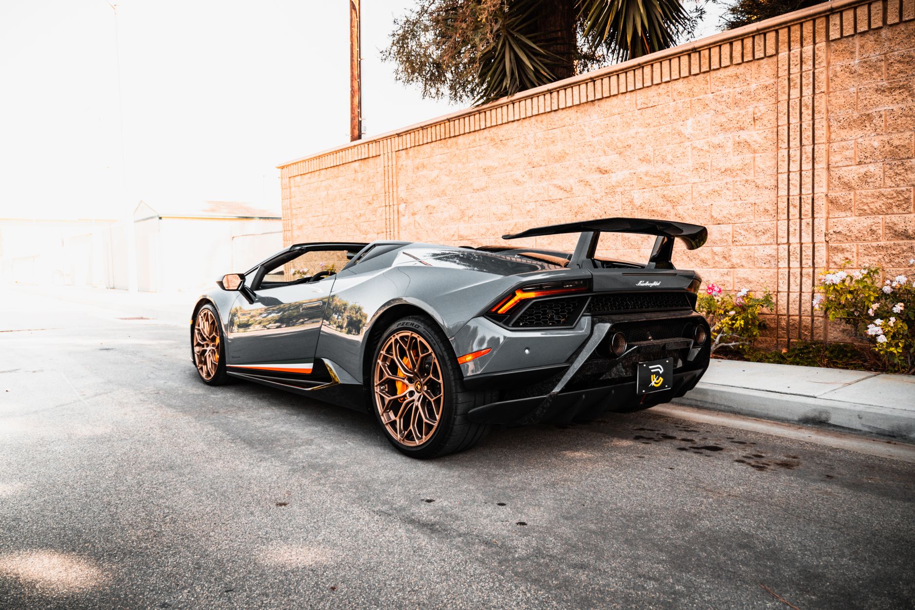 A sleek Lamborghini sports car parked in an urban setting, showcasing luxury automotive design.