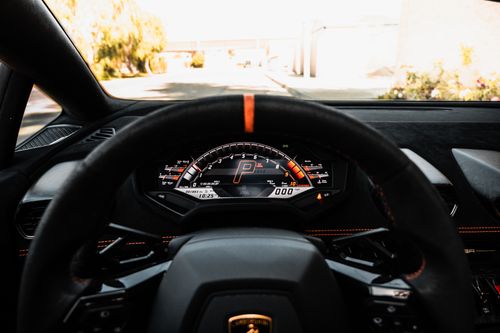 Free Detailed view of a luxury car's dashboard and speedometer, highlighting modern auto design. Stock Photo