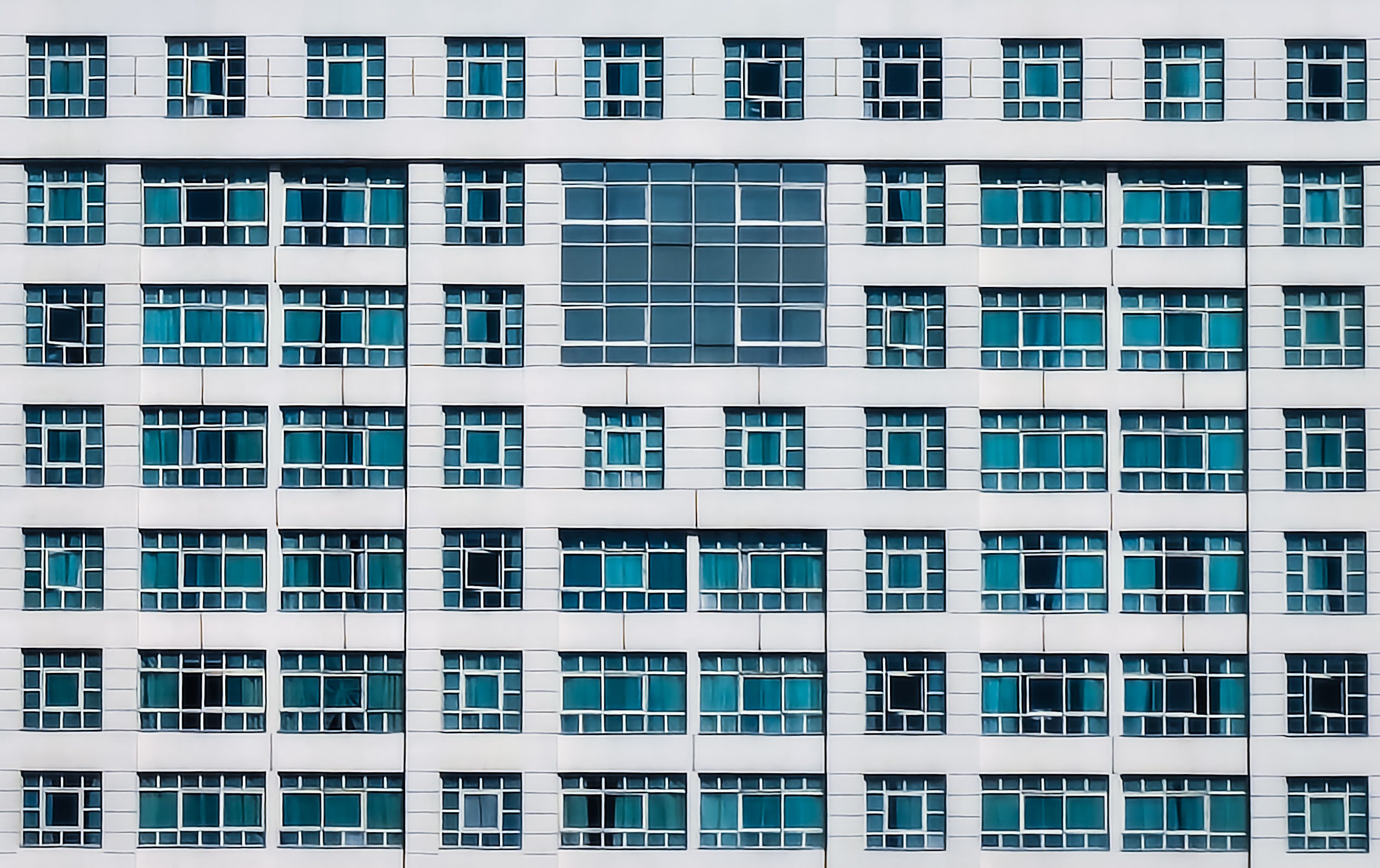 Modern Building Facade with Repetitive Windows · Free Stock Photo