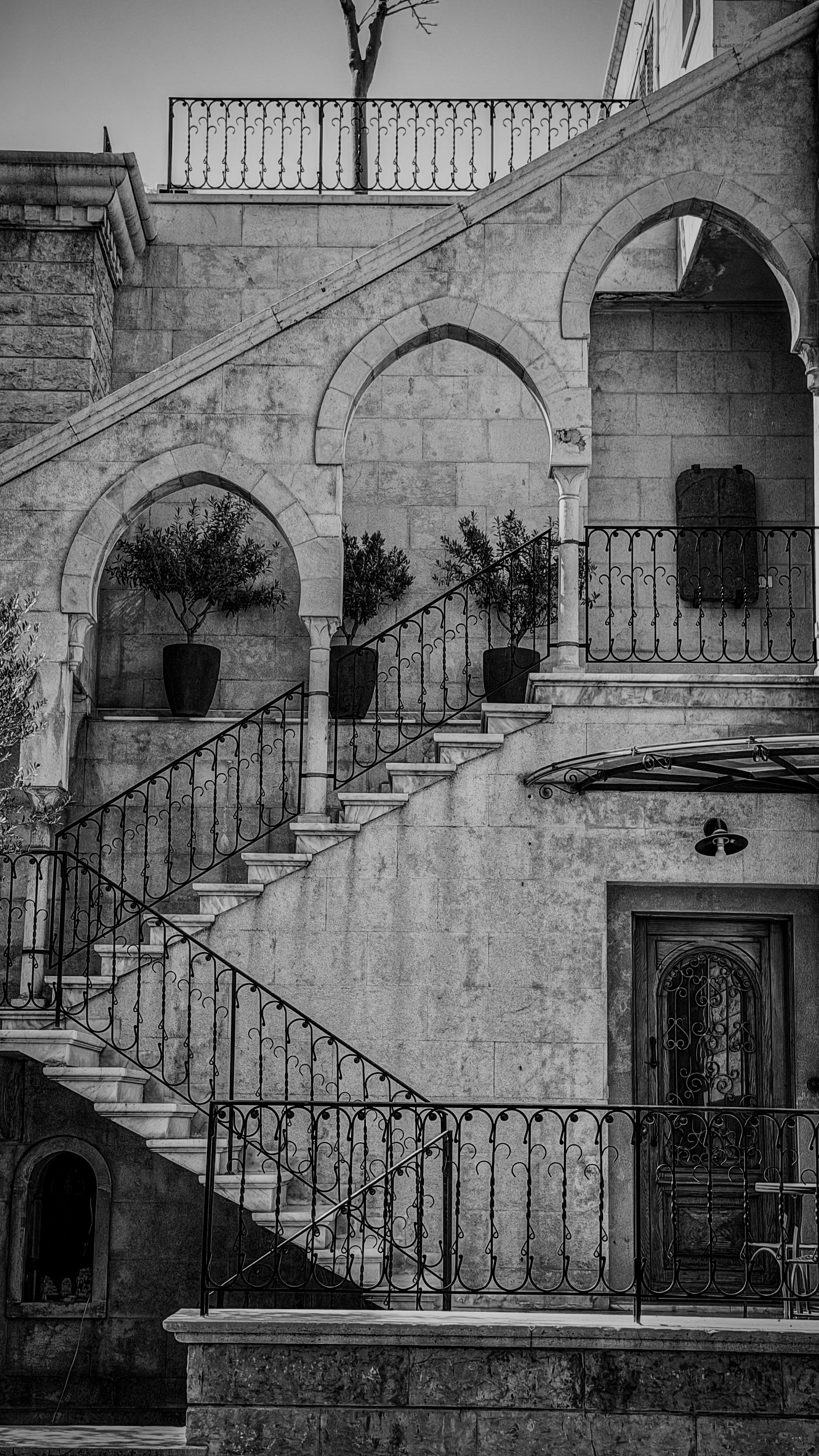 Black and white photo of a vintage stone staircase in Mount Lebanon, showcasing traditional Lebanese architecture.