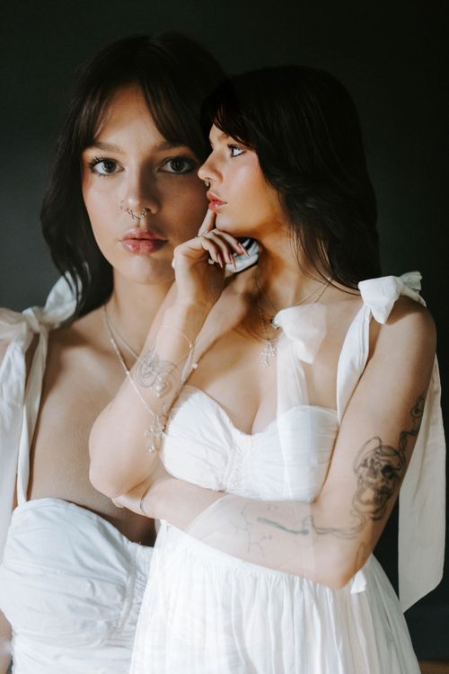 Free Artistic double exposure of a woman in white dress, expressing introspection. Stock Photo