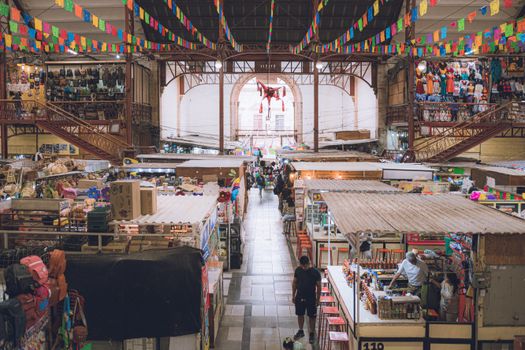 Explore the colorful interior of a bustling market in Guanajuato, Mexico, featuring local vendors and vibrant decor.