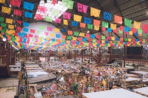 Free Vibrant interior of Mercado Hidalgo in Guanajuato with papel picado decorations. Stock Photo