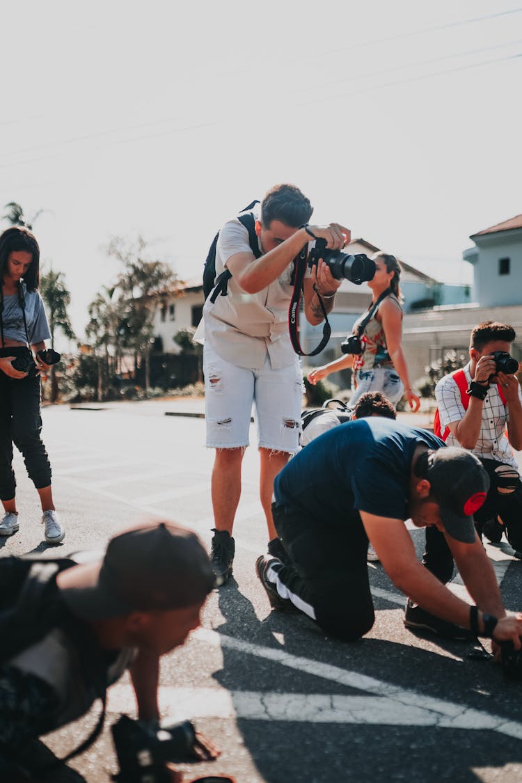 Group Of Diverse Photographer Taking Photos On Street