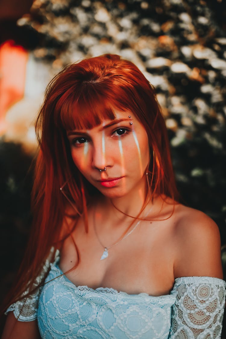 Stylish Woman With Eyebrow Piercing And Necklace Outdoors