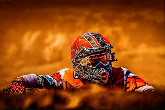 A thrilling close-up of a motocross rider navigating dirt in vibrant gear.
