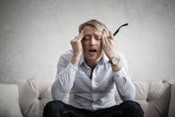 Photo Of Man Touching His Head