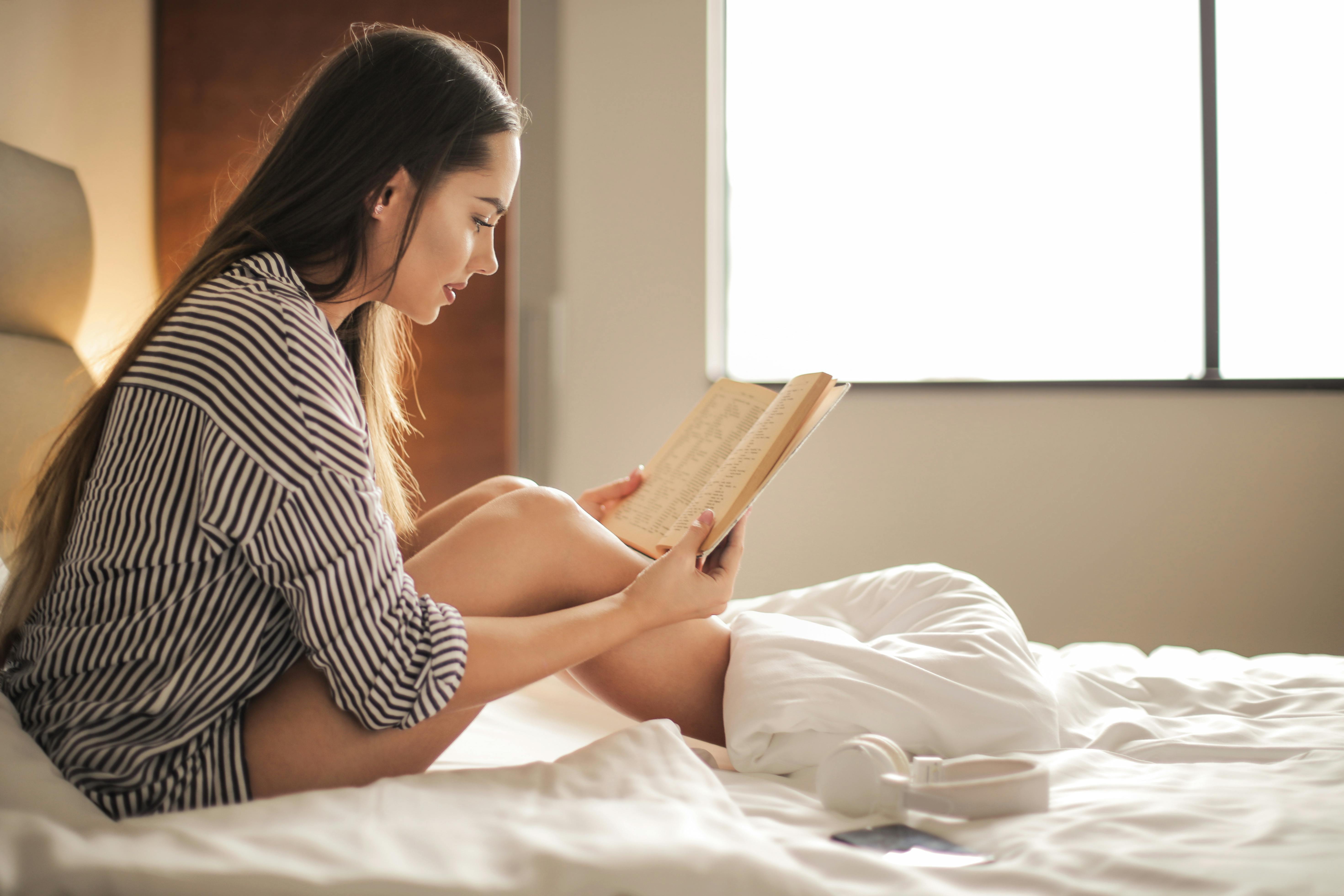 Wallpaper : women, barefoot, sitting, in bed, books, reading, tank