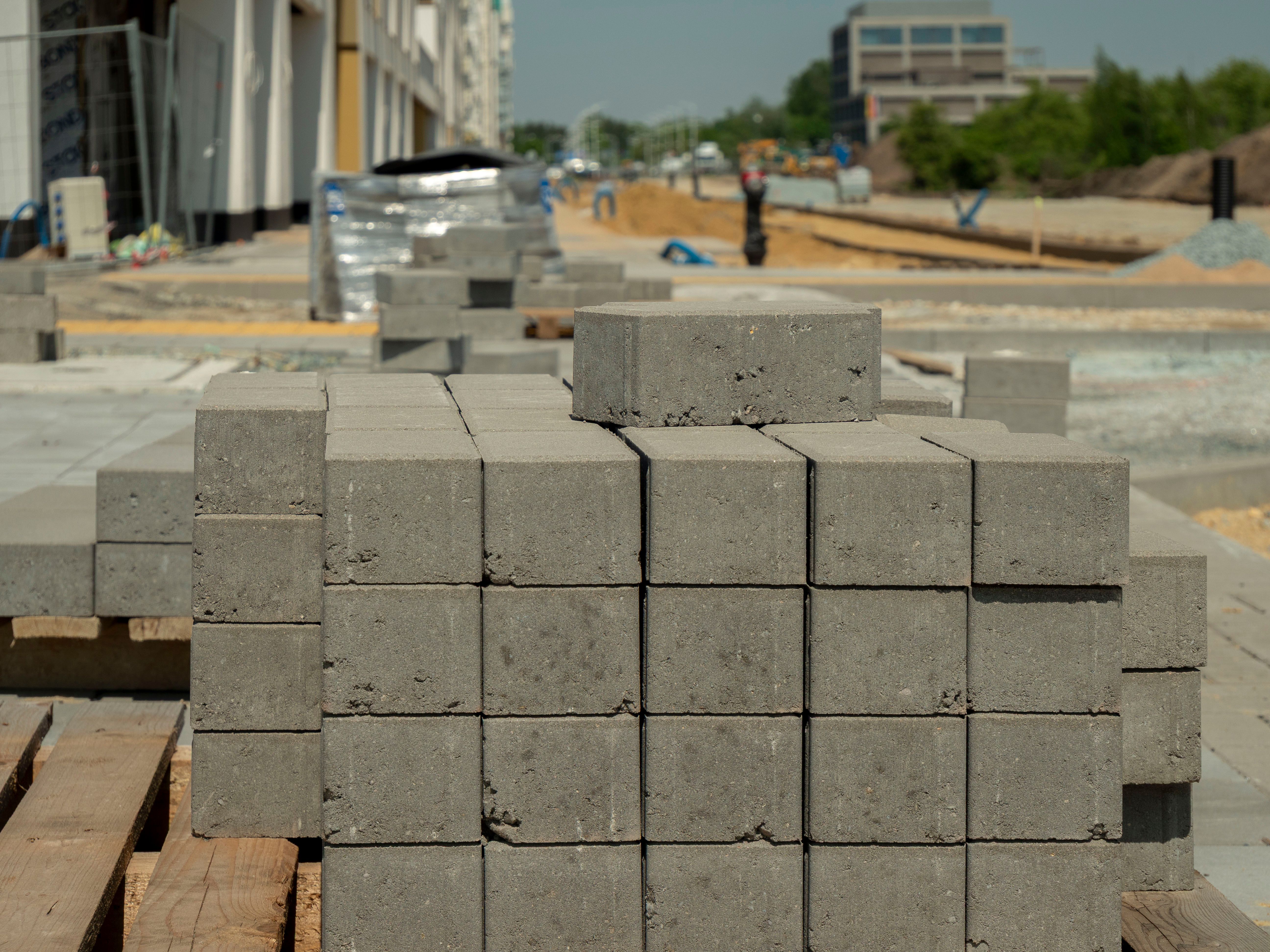 Concrete blocks stacked at a construction site in Wrocław, Poland, showcasing urban development.