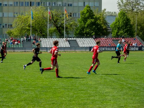 Free Players competing in a youth soccer match at a stadium in Wrocław, Poland. Stock Photo