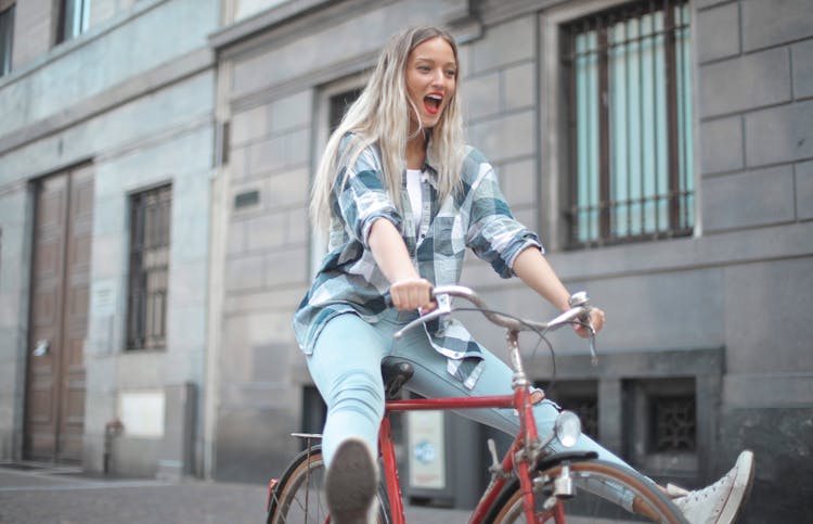 Photo Of Woman Riding Bicycle