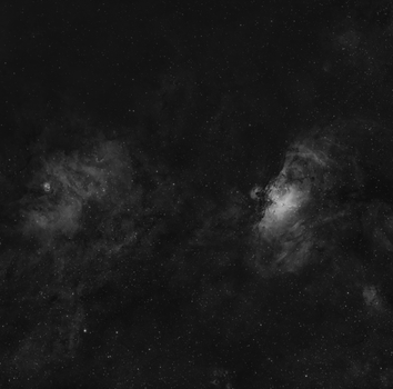Black and white image of a star-filled night sky, showcasing celestial beauty.