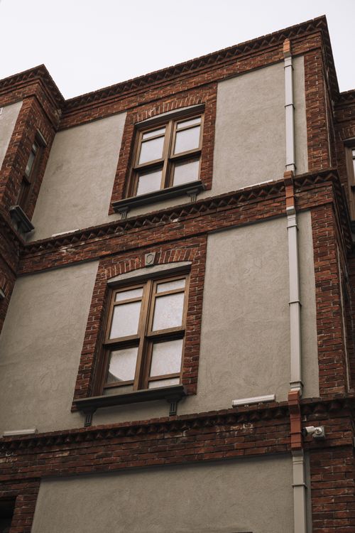 Retro Building Windows Vintage Brick Building with Decorative Windows · Free Stock Photo