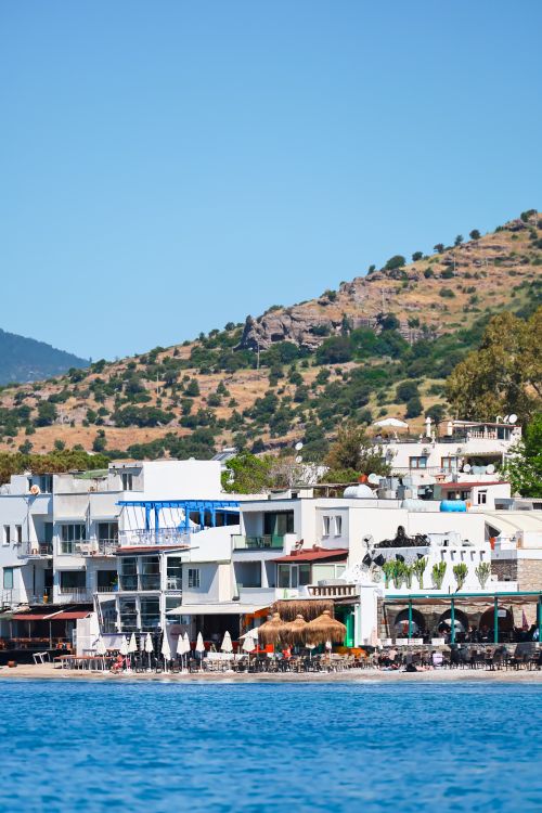 Free Charming coastal buildings with hills in the background in Bodrum, Türkiye. Stock Photo