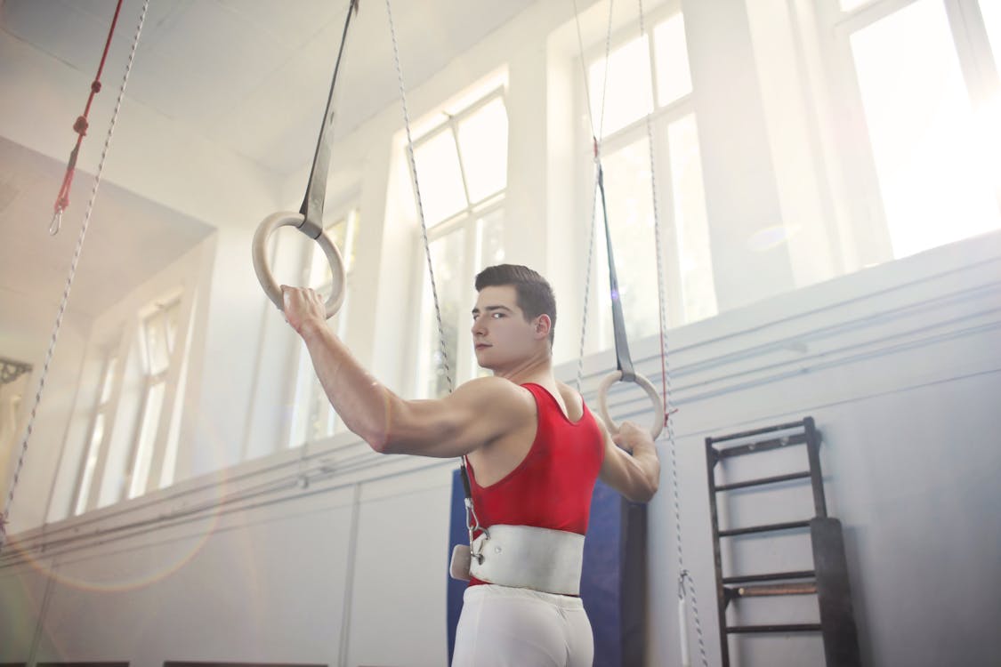 Photo Of Man Wearing Red Tank Top