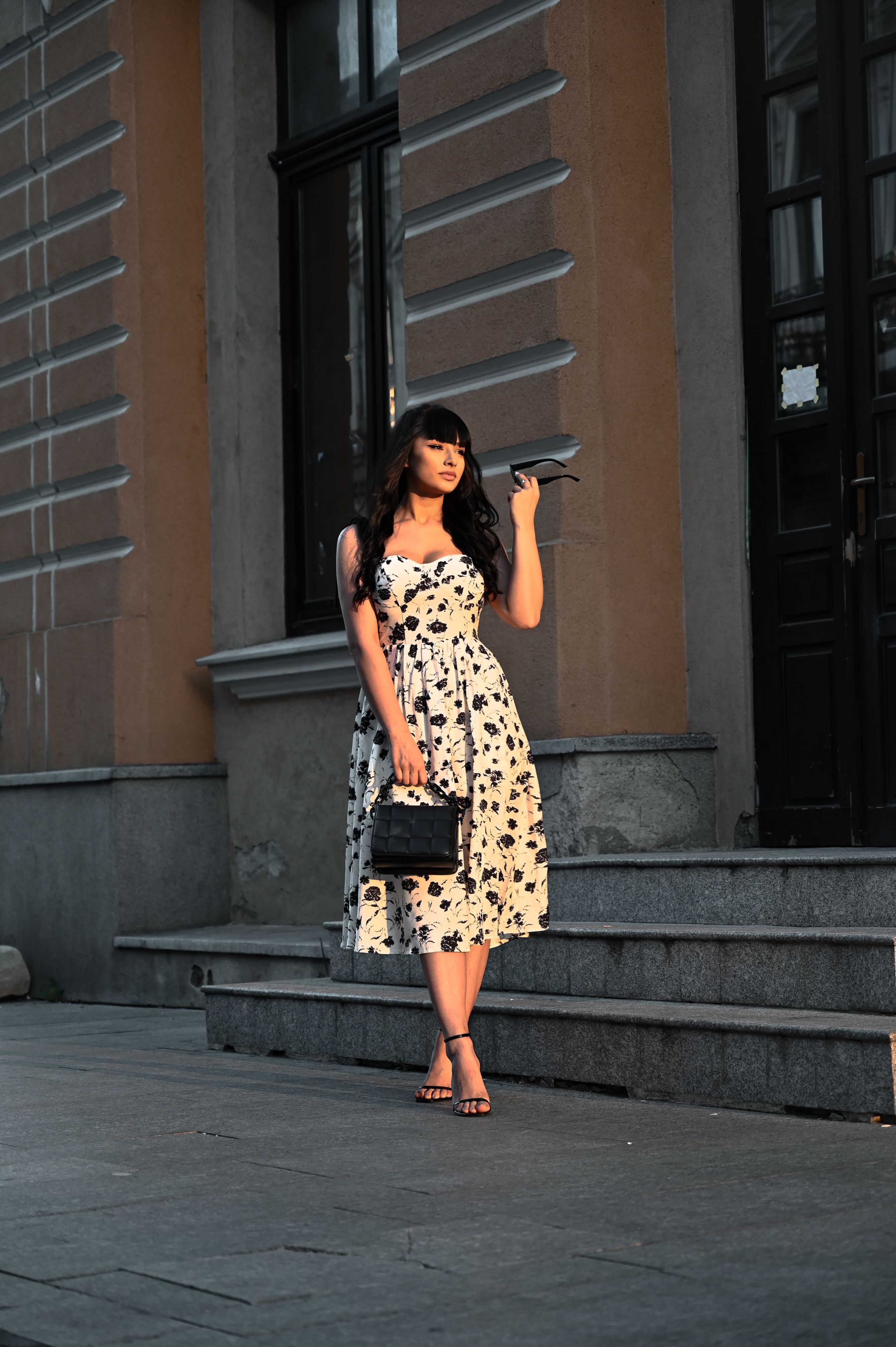 Elegant Woman in Floral Dress on City Street · Free Stock Photo
