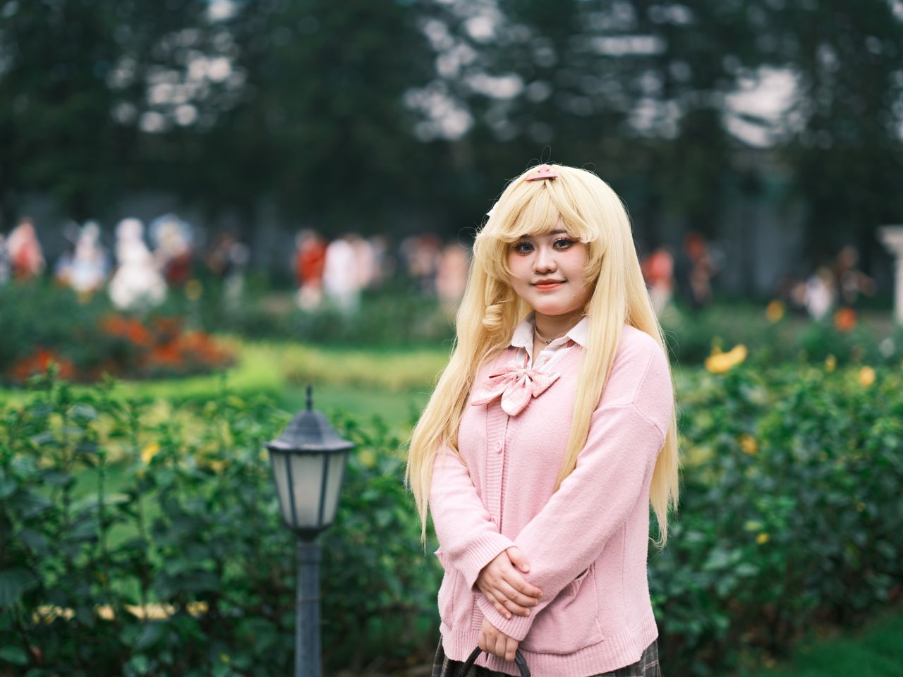 a captivating cosplay portrait of a person in a pink outfit posing in