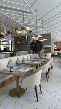 Stylish restaurant interior with elegant decor, seating, and ambient lighting.