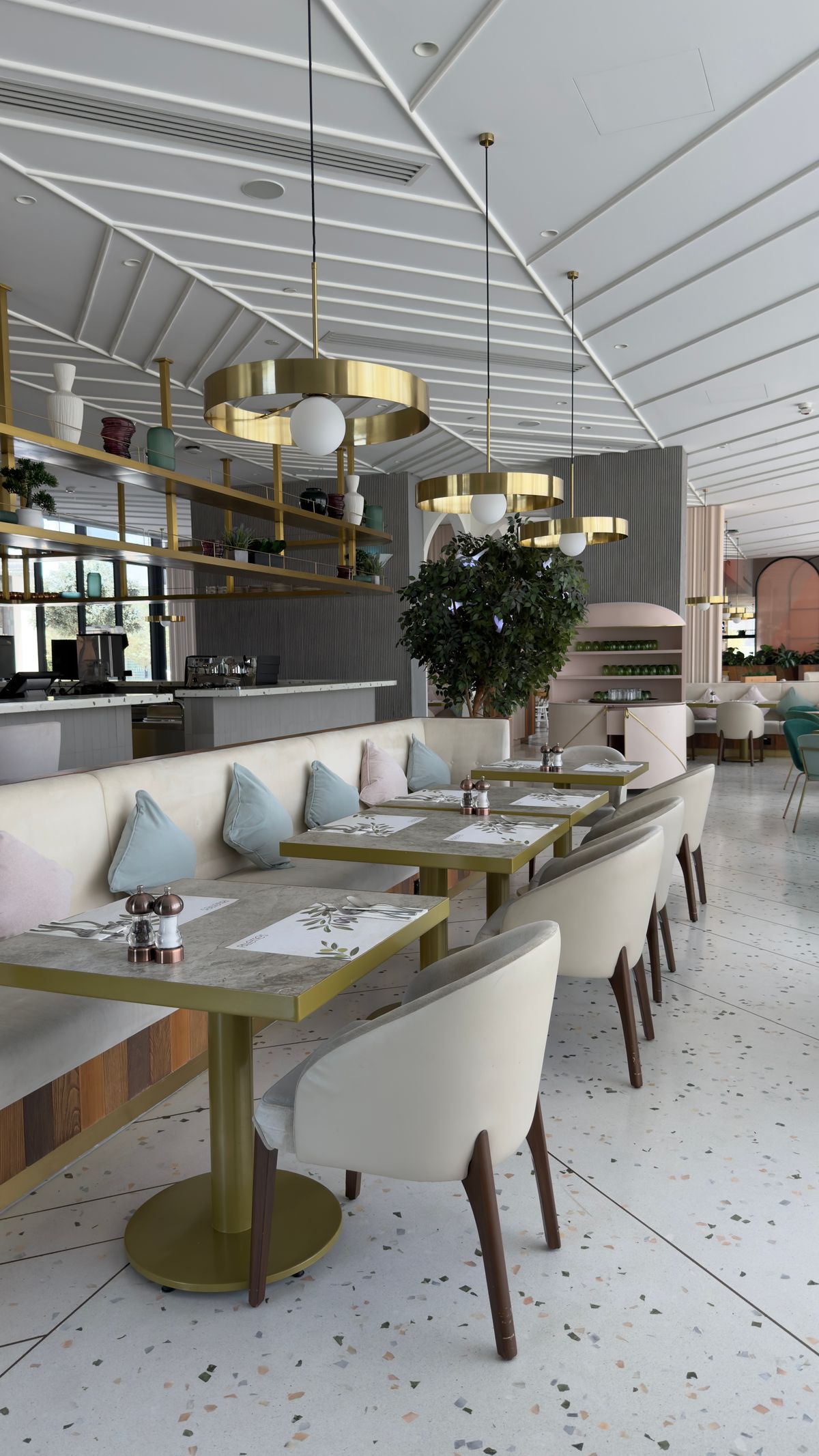An upscale restaurant interior with large windows and clean lines