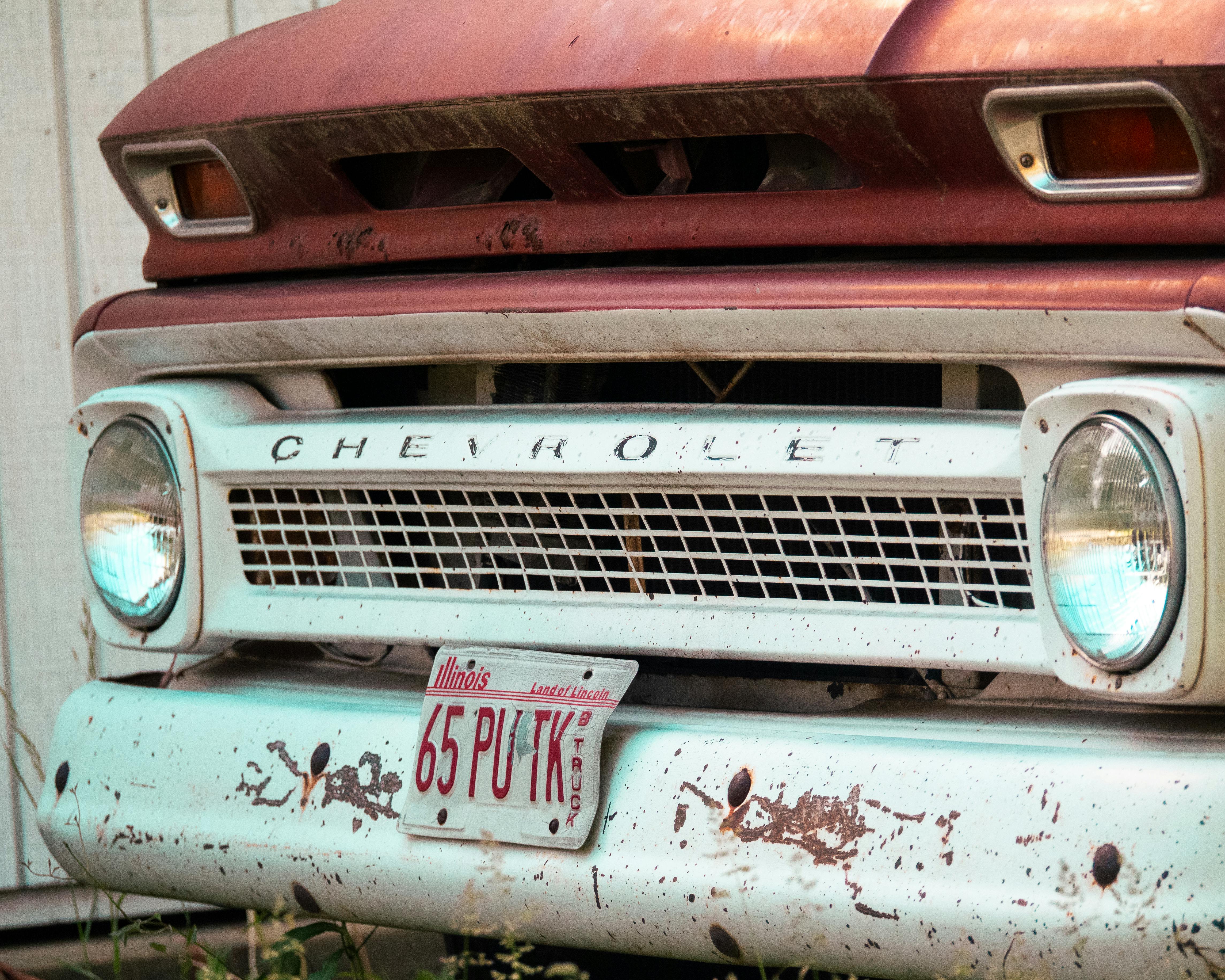 A close-up of a vintage Chevrolet truck front with Illinois license plate, captured in Springfield.