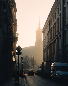 Picturesque Kraków street view with Marienkirche in morning light, Poland.