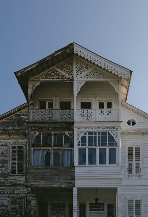 Free A split view of an old versus restored wooden house facade in Istanbul, showcasing contrast. Stock Photo
