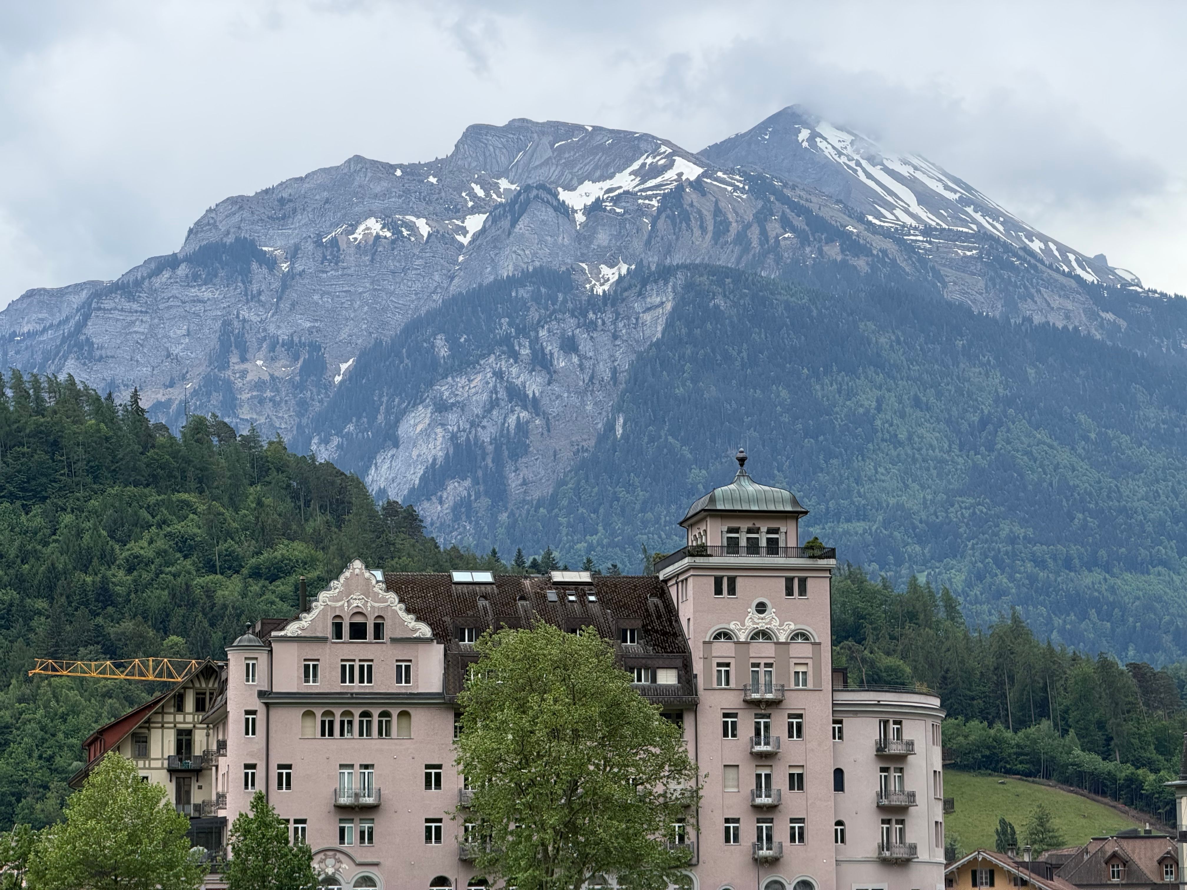 Scenic Swiss Alps with Historic Building · Free Stock Photo