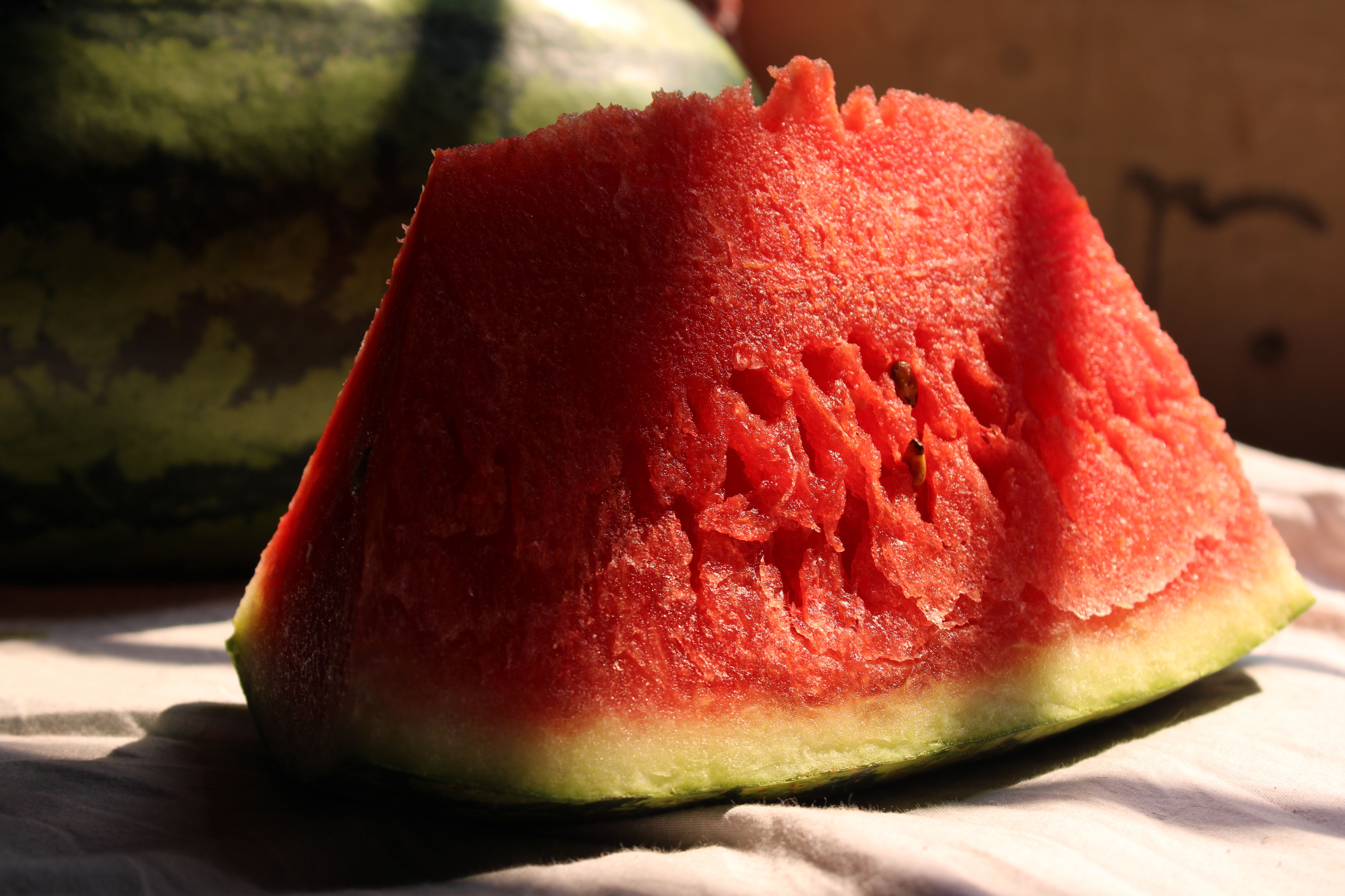 Close-up of a Juicy Watermelon Slice in Sunlight · Free Stock Photo