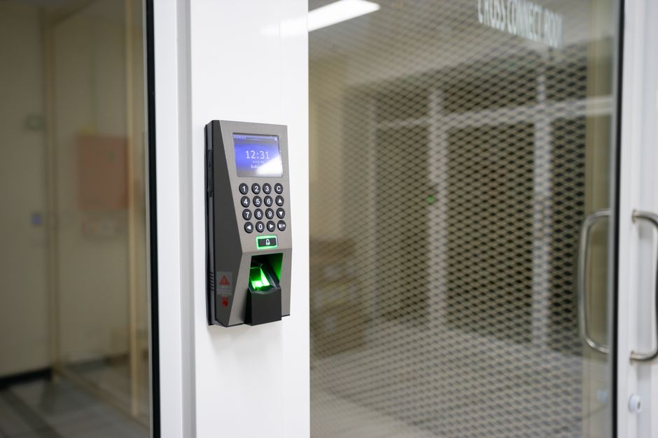 A modern fingerprint scanner for secure access control in an office environment.