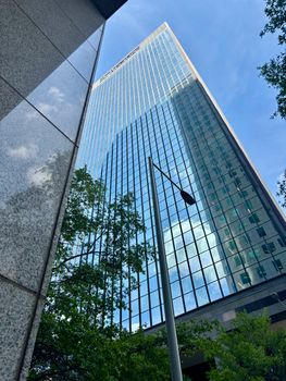 A sleek skyscraper reflecting the sky in Birmingham, Alabama.