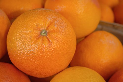 Free Close-up image of fresh oranges with vibrant texture, perfect for healthy lifestyle themes. Stock Photo