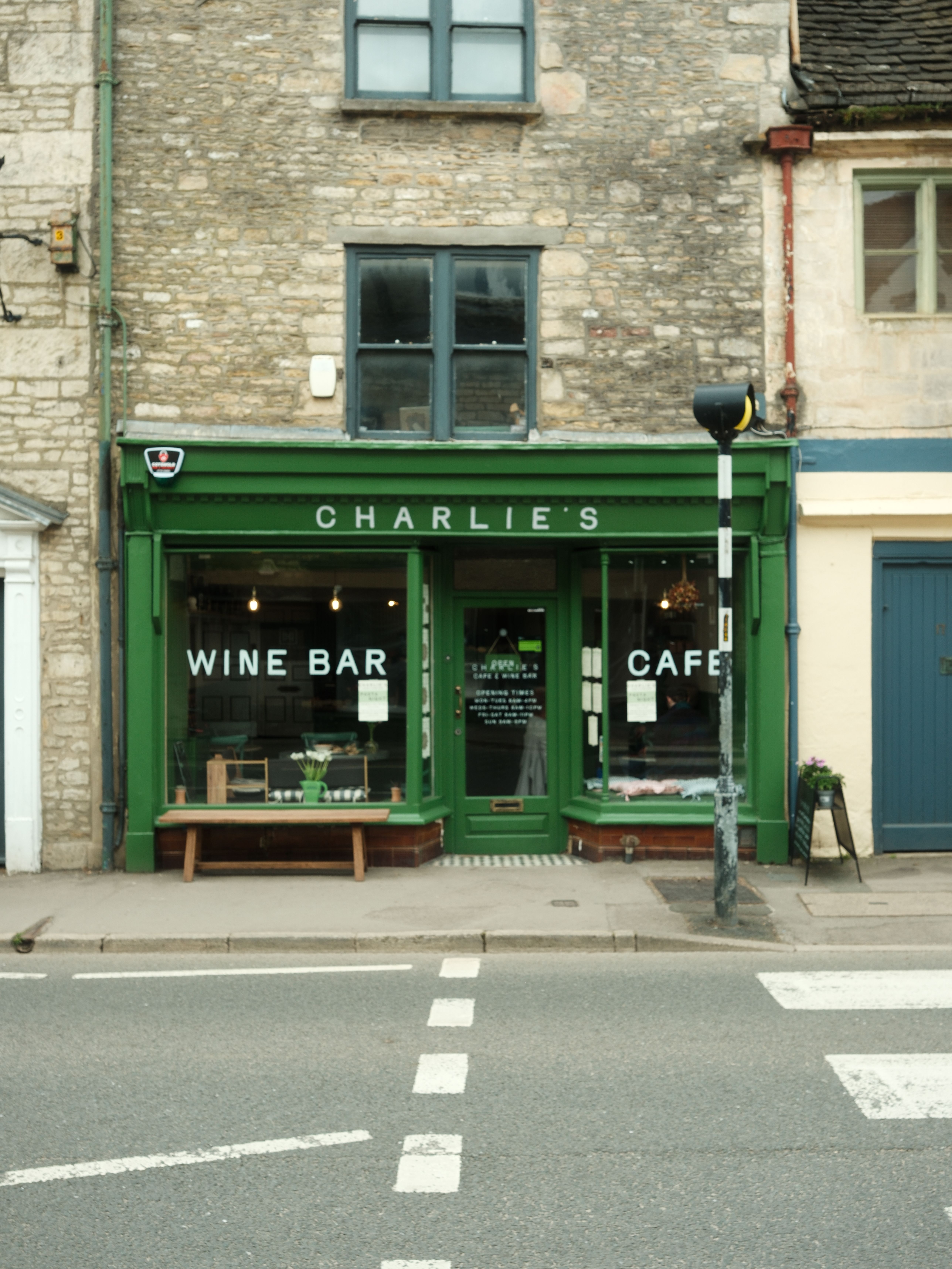 Quaint wine bar and cafe on a charming stone building street corner.