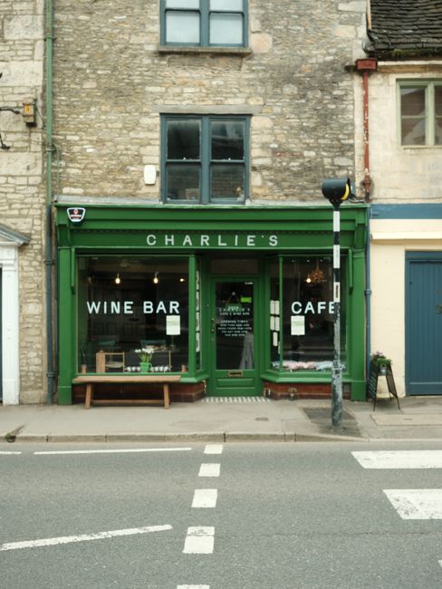 Quaint wine bar and cafe on a charming stone building street corner.