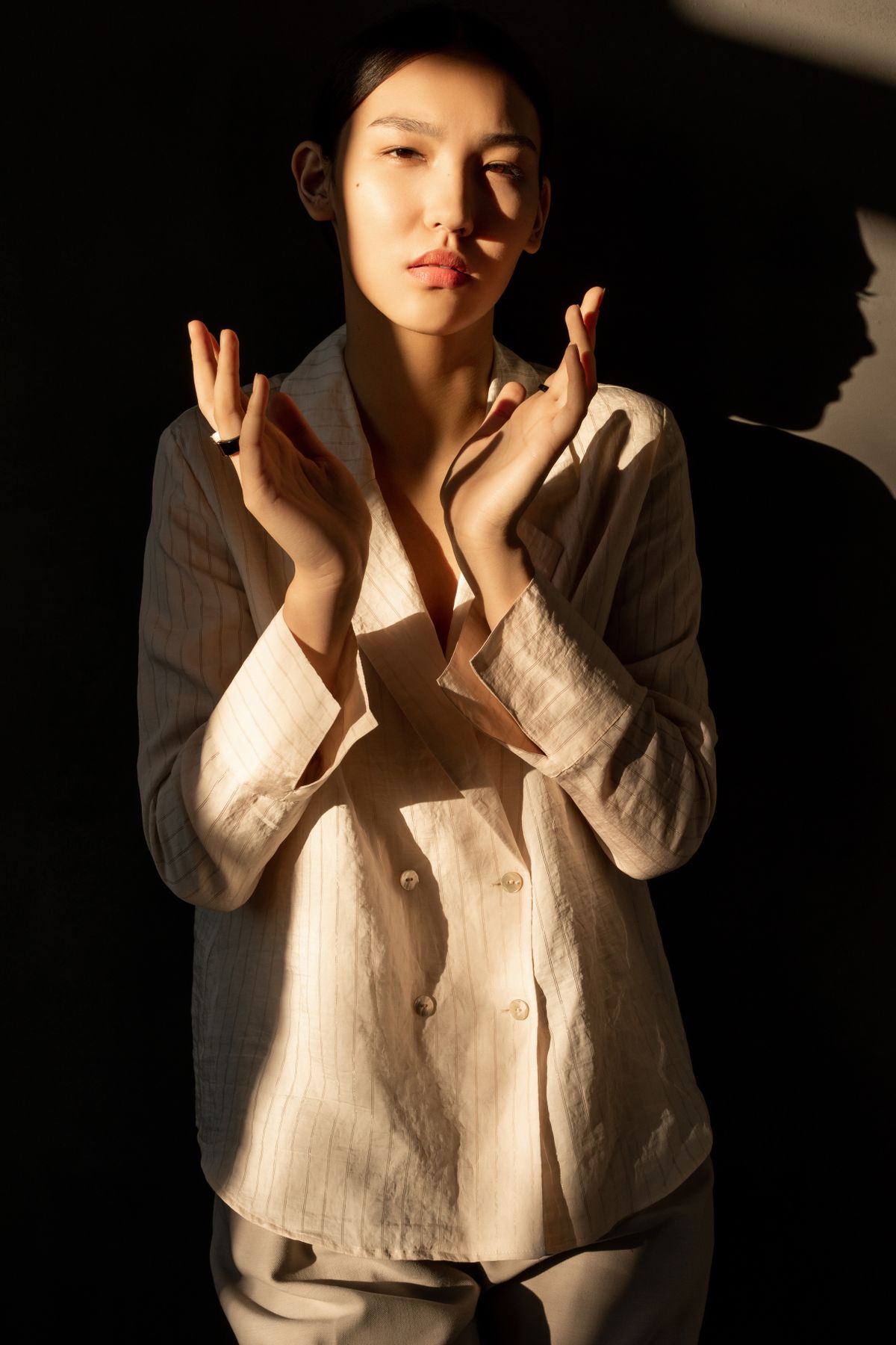 A woman in elegant neutral tailoring