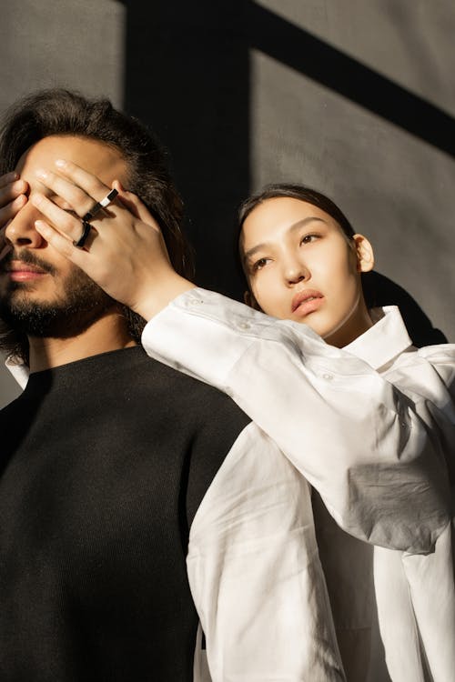 Free Woman Covering Man's Face Stock Photo