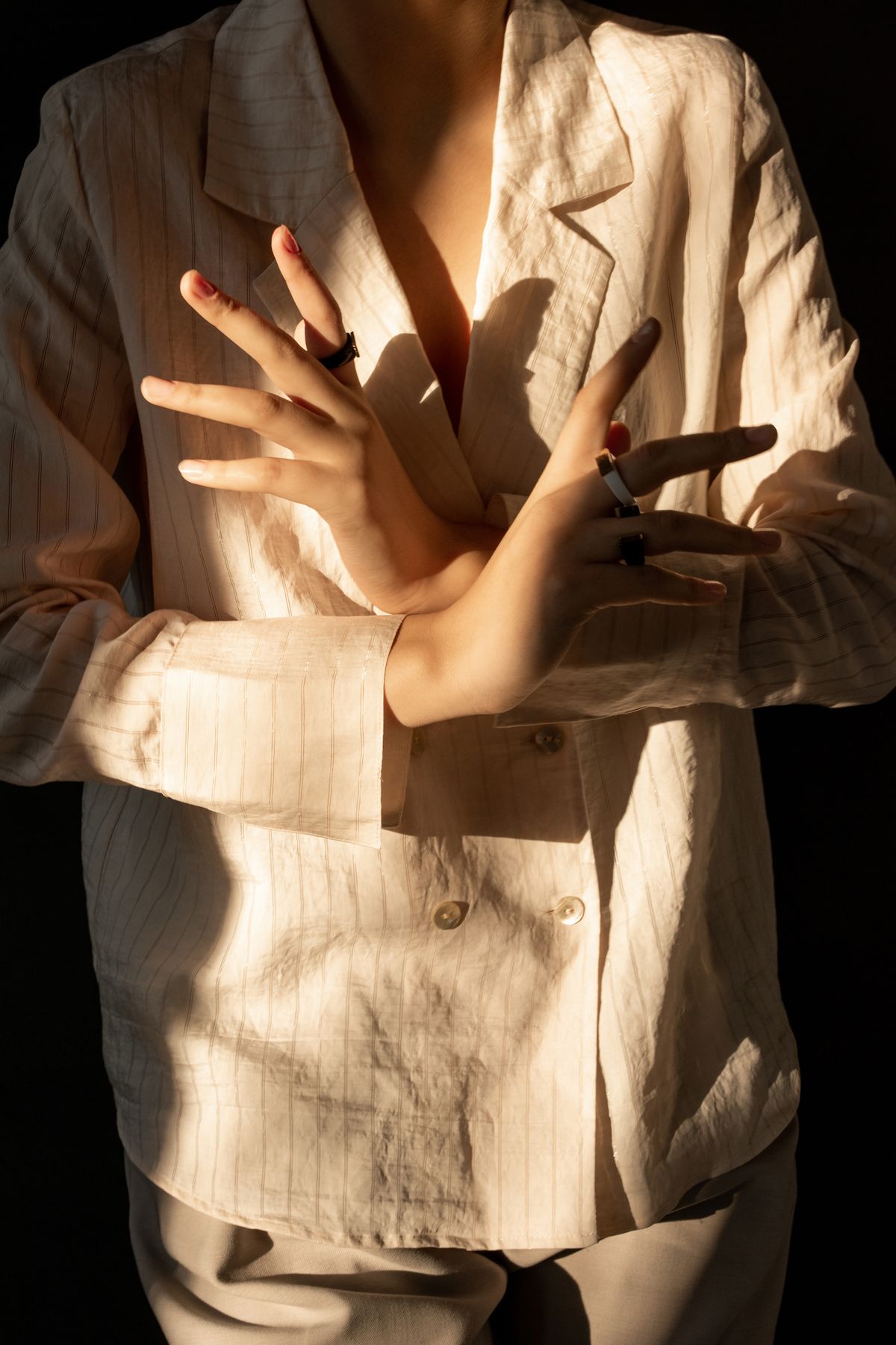 A person in a white long-sleeve shirt — the crisp foundation of tailoring